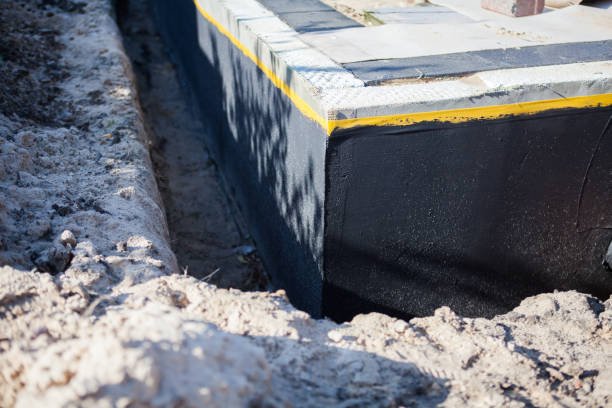 Professional Basement Waterproofing technician working in Elizabethtown, KY